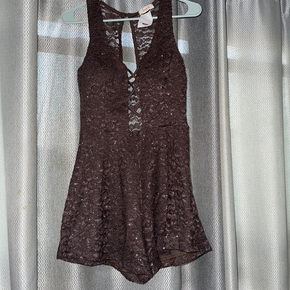 Brand new with tags women sparkly mocha romper, size Medium